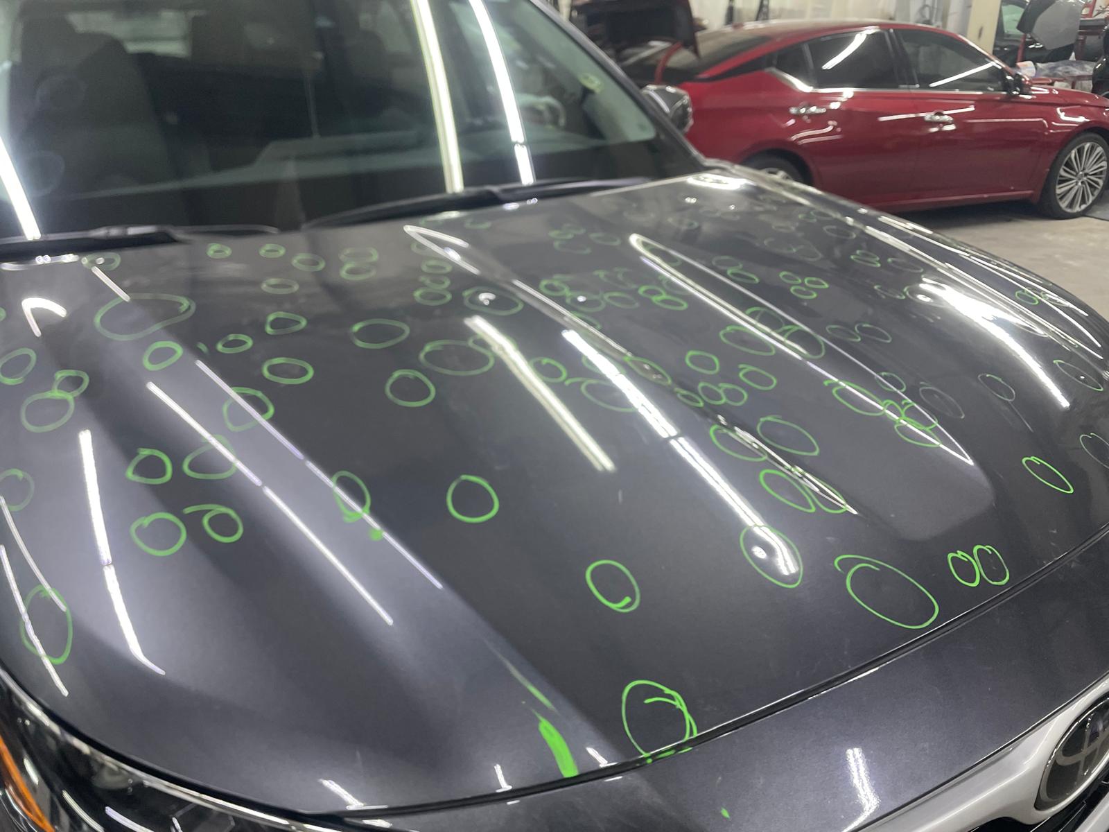 Dent removed from car fender